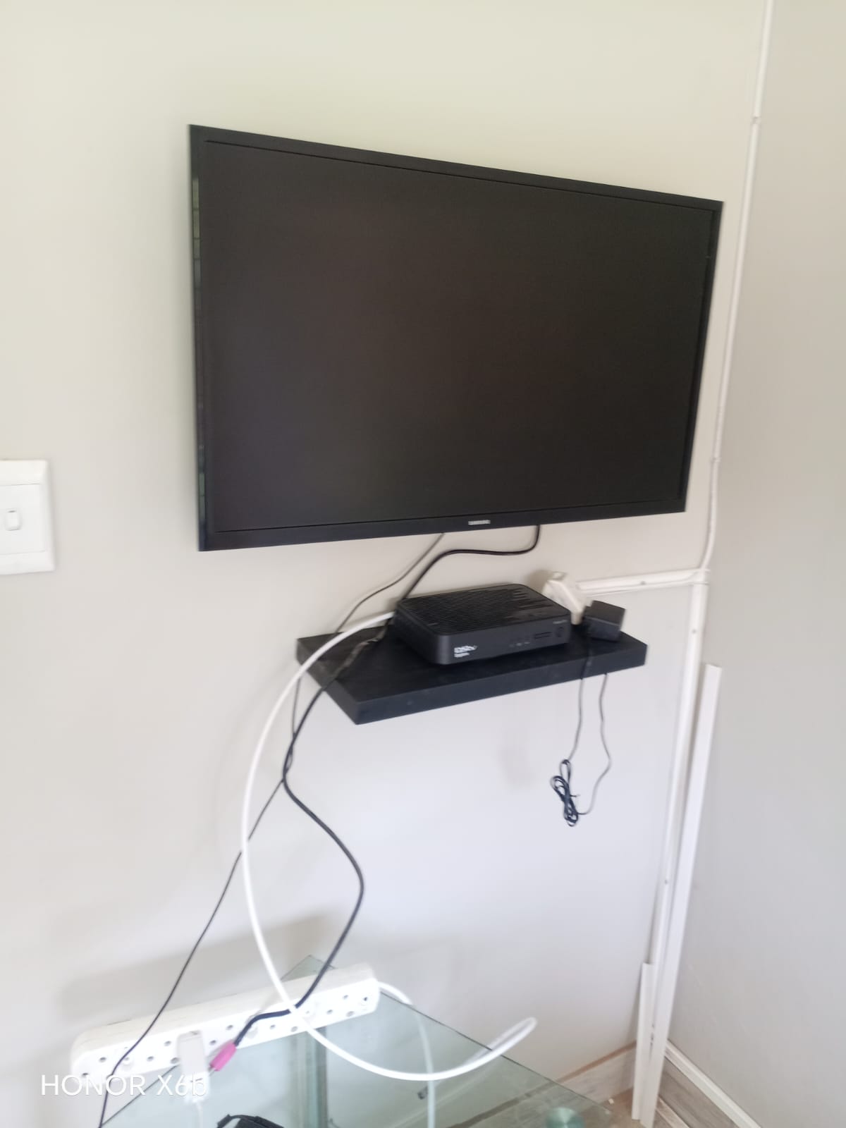 DStv technician working in a Claremont apartment complex