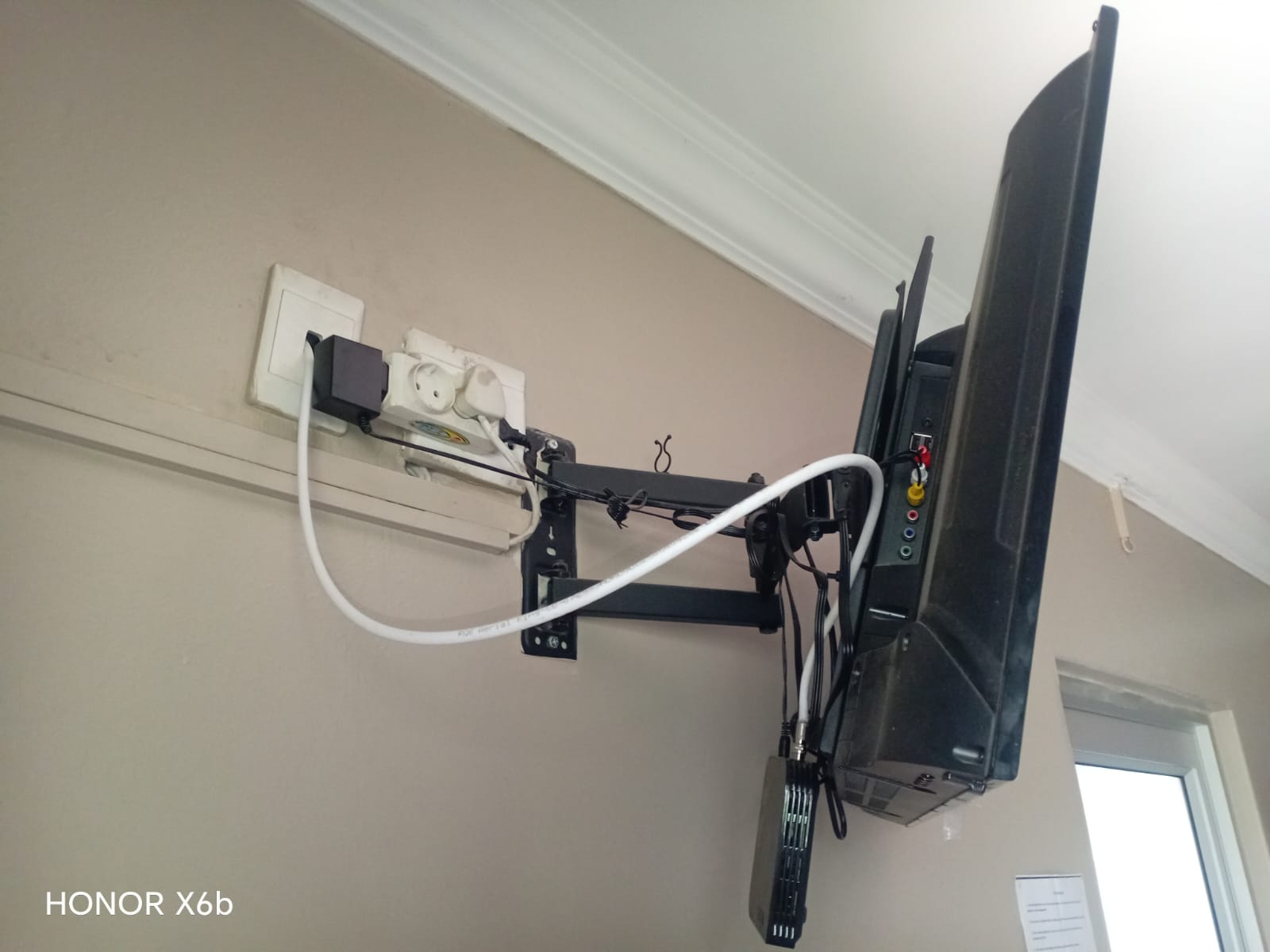 DStv technician working on a Durbanville family home